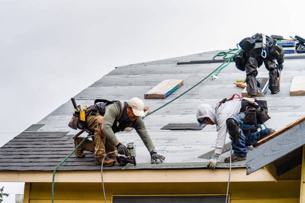 Professional Roofing technician working in Charlton, MA